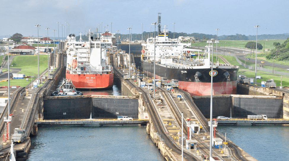 Ships Navigating Canal Locks for Maritime Trade | eFinancialModels Two ships navigating locks, illustrating maritime trade logistics.