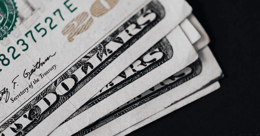 U.S. Dollar Bills for Financial Analysis | eFinancialModels Stack of U.S. dollar bills symbolizing cash flow in financial planning.