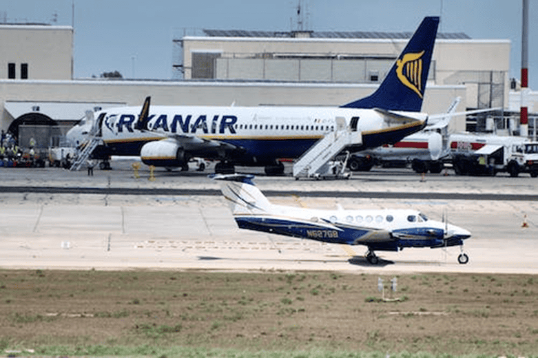 Airplanes on Airport Tarmac Comparison | eFinancialModels Comparison of commercial and private aircraft on an airport runway.