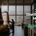 Copper distillery interior with a worker inspecting a still, large windows overlooking mountains; foregrounded text reads 'Japan Distilleries Market Study 2026-2031' for eFinancialModels.